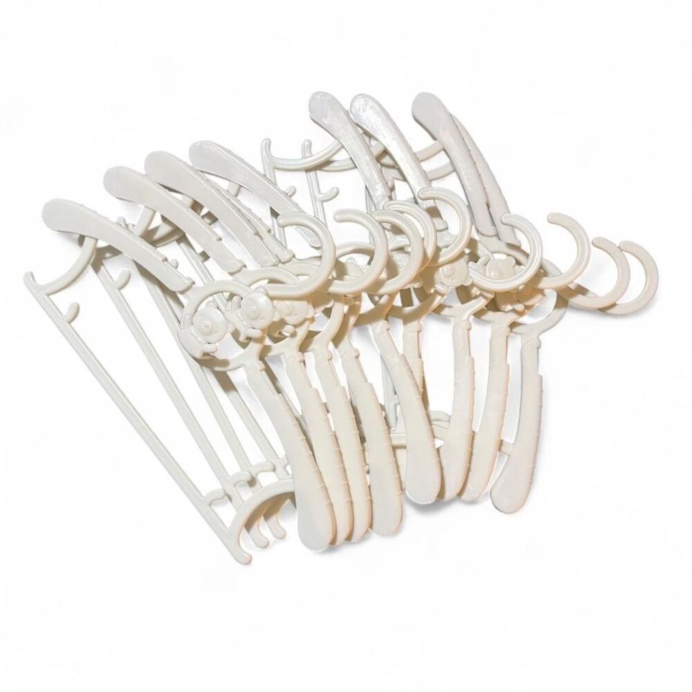 9 White plastic baby clothes hangers with bear design